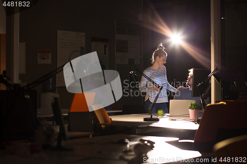 Image of young designers in the night office