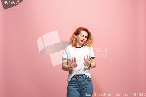 Image of Let me think. Doubtful pensive woman with thoughtful expression making choice against pink background