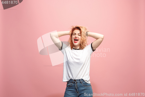 Image of Isolated on pink young casual woman shouting at studio