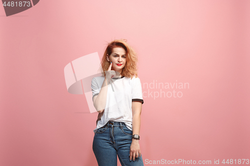 Image of Let me think. Doubtful pensive woman with thoughtful expression making choice against pink background