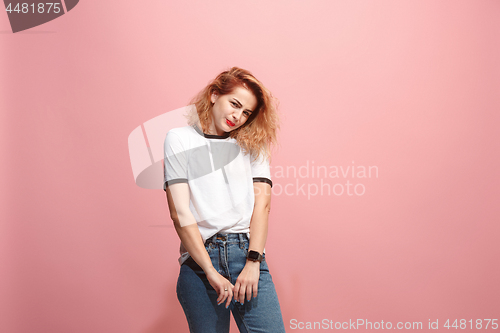 Image of Let me think. Doubtful pensive woman with thoughtful expression making choice against pink background