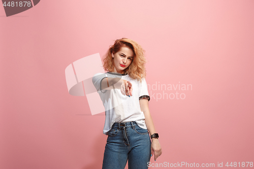 Image of The overbearing business woman point you and want you, half length closeup portrait on pink background.