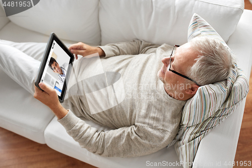 Image of senior patient having video chat with doctor