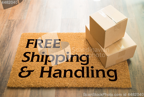 Image of Free Shipping and Handling Welcome Mat On Wood Floor With Shipme