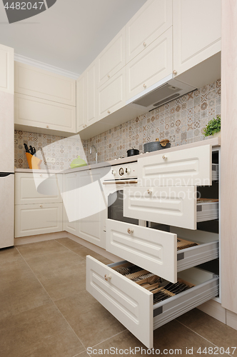 Image of Modern beige colored kitchen and dining room