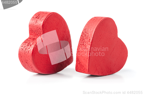 Image of Two red wooden hearts isolated on white