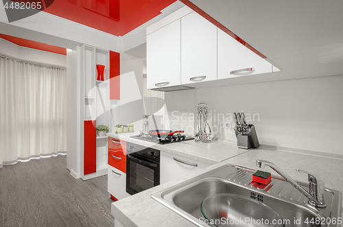 Image of Modern red and white kitchen interior