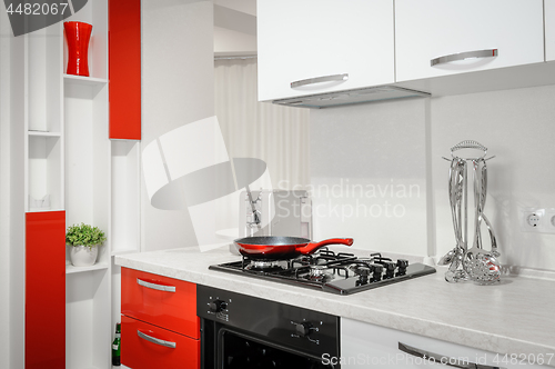 Image of Modern red and white kitchen interior