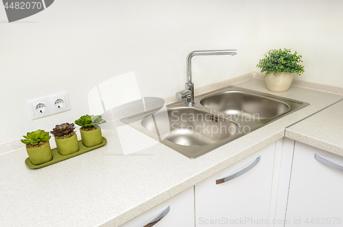 Image of Modern white kitchen with sink