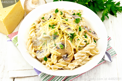 Image of Fusilli with mushrooms on towel