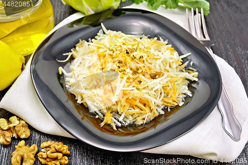 Image of Salad of carrot and kohlrabi with honey in plate on board