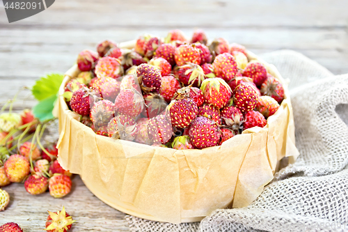 Image of Strawberries in box on board