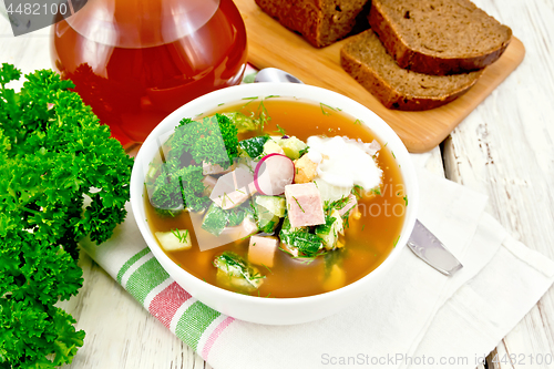 Image of Okroshka in white bowl on napkin