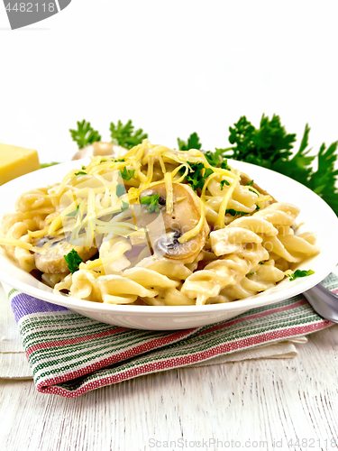 Image of Fusilli with mushrooms and cream on napkin