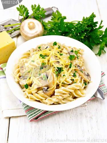 Image of Fusilli with mushrooms and cream on board