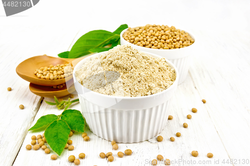 Image of Flour soy with soybeans and leaf on wooden board