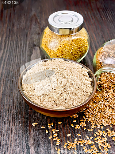 Image of Flour linen in bowl with seeds in jars on board