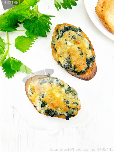 Image of Sandwich of nettle and cheese on board top