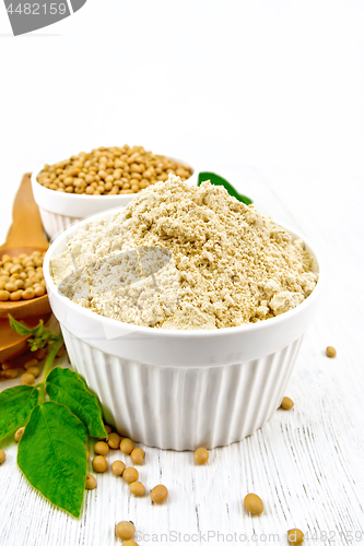 Image of Flour soy with soybeans on wooden board