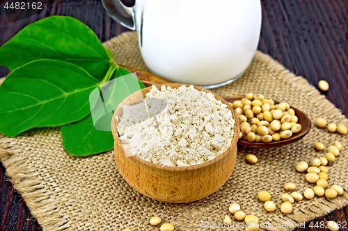 Image of Flour soy in bowl with soybeans and leaf on sacking