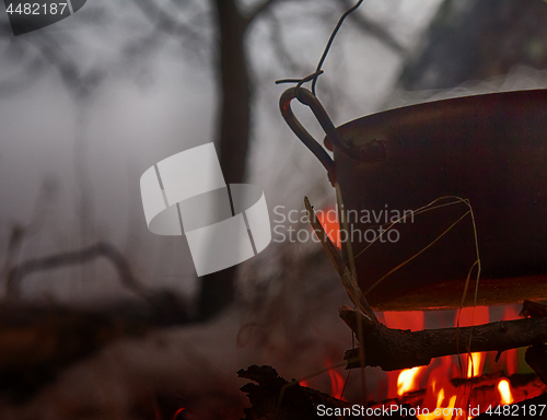 Image of picnic in winter on nature of a bonfire