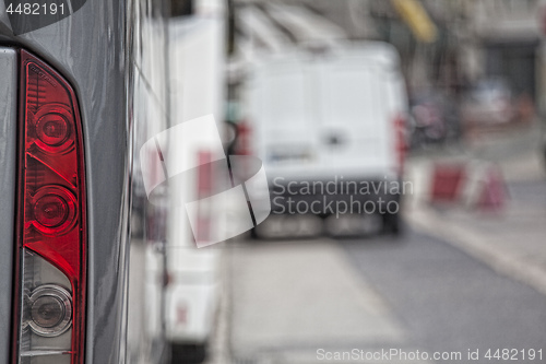 Image of back view of bus, red side lamp