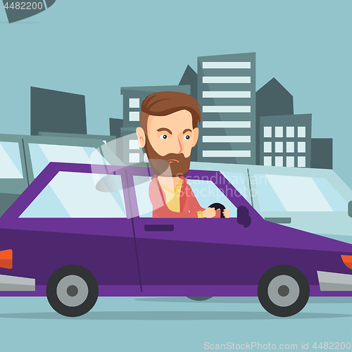 Image of Angry caucasian man in car stuck in traffic jam.