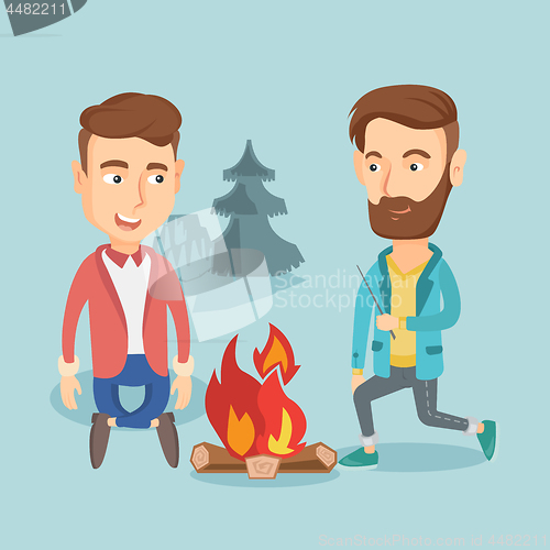 Image of Two friends sitting around bonfire in camping.