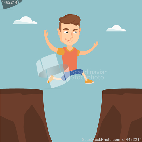 Image of Sportsman jumping over the cliff.