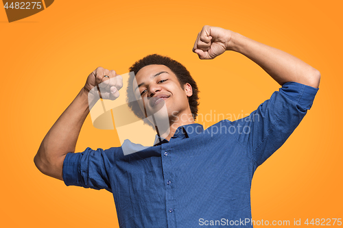 Image of Winning success man happy ecstatic celebrating being a winner. Dynamic energetic image of male model