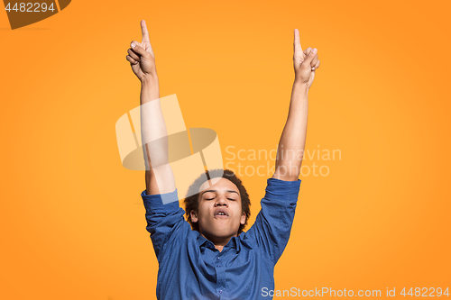 Image of Winning success man happy ecstatic celebrating being a winner. Dynamic energetic image of male model