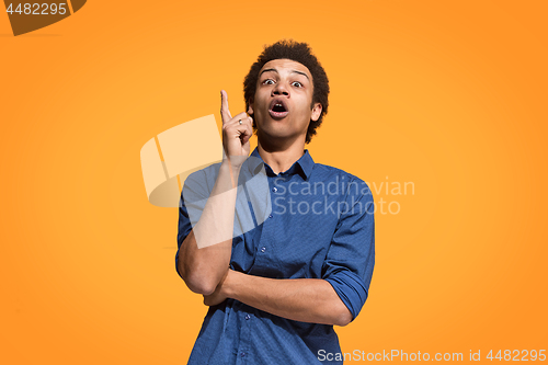 Image of Young serious thoughtful businessman. Doubt concept.