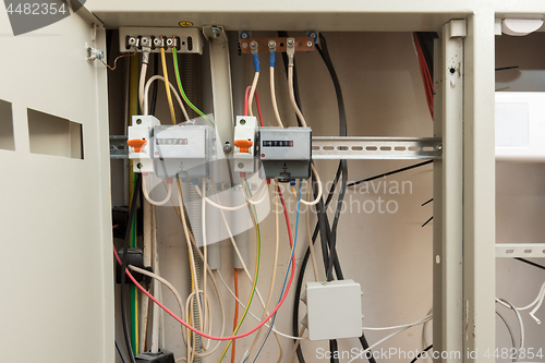 Image of Two electronic electrical meters and a junction box