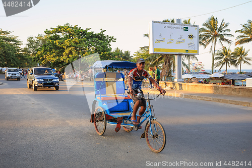 Image of Traditional rickshaw bicycle with malagasy peoples in Toamasina,