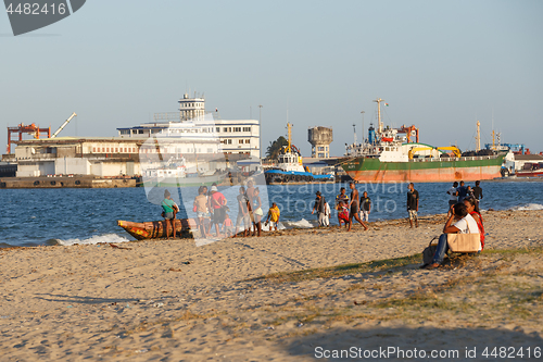 Image of Malagasy peoples resting on the beach in harbor