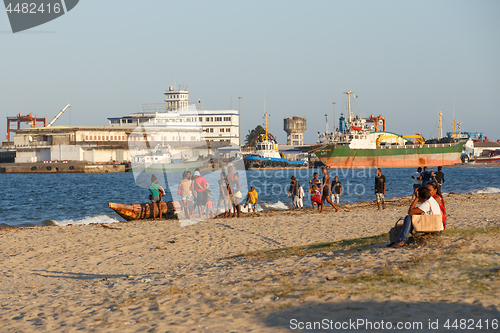 Image of Malagasy peoples resting on the beach in harbor