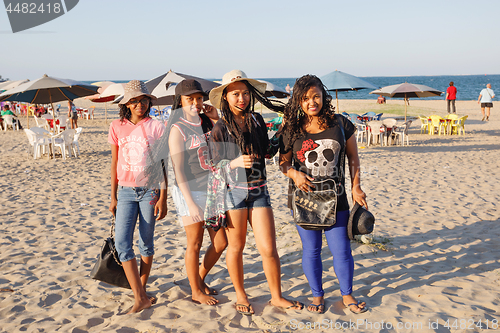 Image of Malagasy beauties, teenager  girls resting on the beach