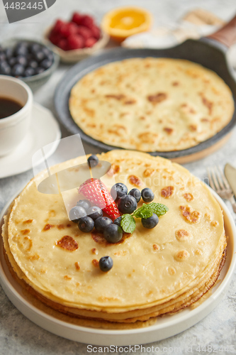 Image of Various breakfast ingredients placed on stone table