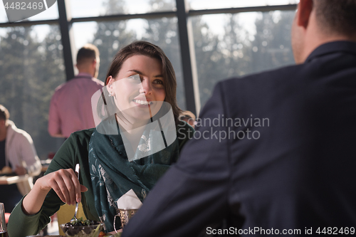 Image of Closeup shot of young woman and man having meal.