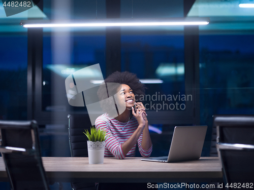 Image of black businesswoman using a laptop in startup office