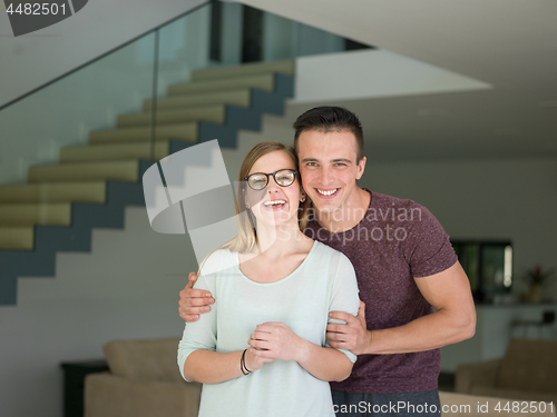 Image of couple hugging in their new home