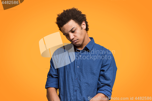 Image of Beautiful bored man bored isolated on orange background