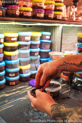 Image of Shisha hookah preparing by barman.