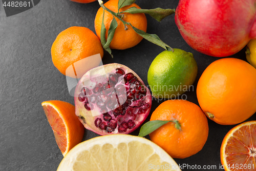 Image of close up of citrus fruits on stone table