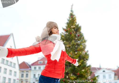 Image of happy woman over christmas tree in tallinn