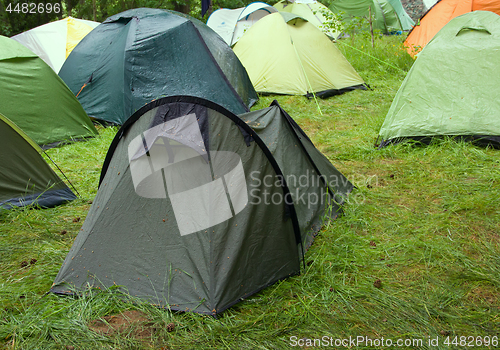 Image of camping outdoor with tent in woods in summer