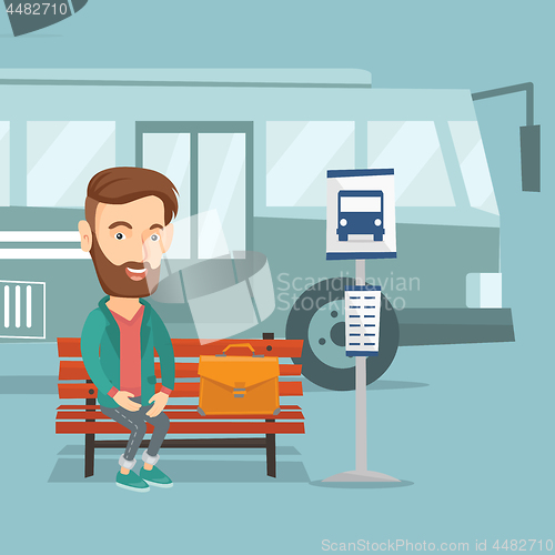 Image of Businessman waiting for bus at the bus stop.