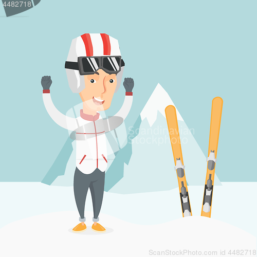 Image of Cheerful skier standing with raised hands.