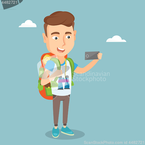 Image of Man with backpack making selfie.