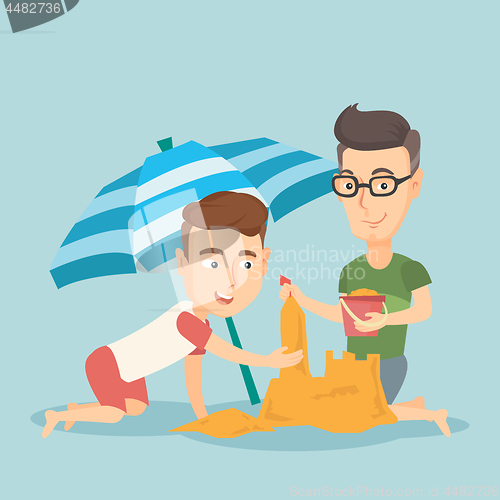 Image of Male friends building sandcastle on the beach.